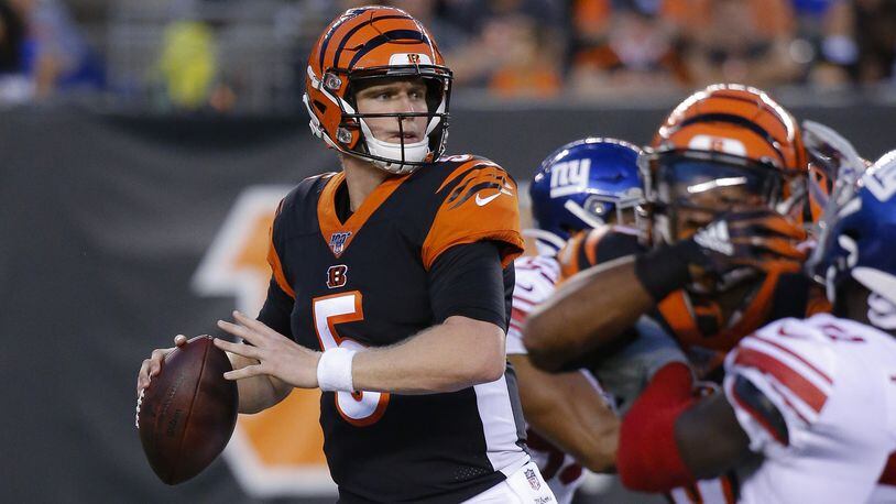 FILE - In this Aug. 22, 2019, file photo, Cincinnati Bengals quarterback Ryan Finley (5) looks to pass during the first half of an NFL preseason football game against the New York Giants, in Cincinnati. The winless Bengals benched Andy Dalton heading into their bye week, ending his nine-season run as starter so they can start developing rookie Ryan Finley as his potential long-term replacement. The move came two days after a 24-10 loss to the Rams in London left Cincinnati 0-8 for the first time in 11 years. (AP Photo/Frank Victores, File)