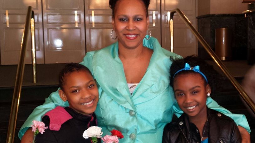 The Rev. Dawn Martin, middle, with two of her mentees from Girls Empowered and Mentored to Success
