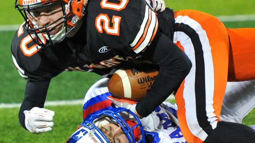 Greeneview’ David VanHorn (bottom) brings down Coldwater’s Nate Rindler (top) during a Div. V, Region 20 semifinal game on Saturday, November 12, 2016 at Sidney Memorial Stadium. Contributed Photo by Bryant Billing