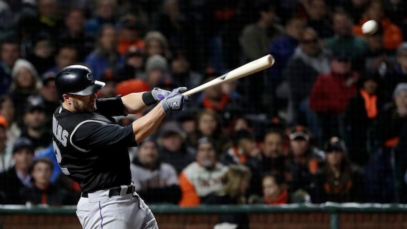 Colorado Rockies' Mark Reynolds drives in a run with a single against the San Francisco Giants during the sixth inning of a baseball game, Thursday, April 13, 2017, in San Francisco. (AP Photo/Marcio Jose Sanchez)