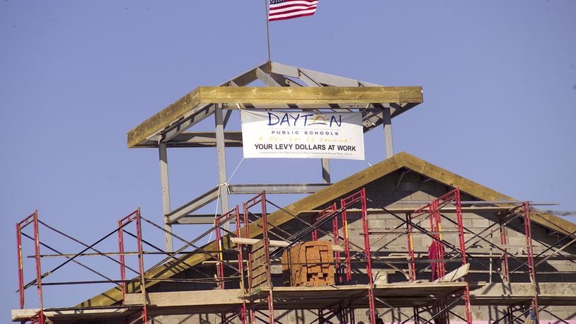The final steel beam of the new Wogaman school on Germantown Street was hoisted into place in January 2006. Nearly 14 years later, Dayton Public Schools officials are weighing how much to spend for maintenance on their relatively new schools. FILE PHOTO
