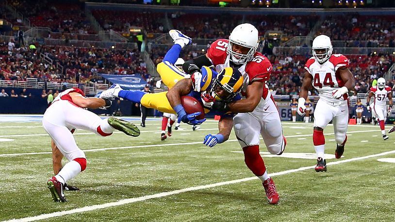 ST. LOUIS, MO - DECEMBER 6: Tavon Austin #11 of the St. Louis Rams is tackled by Kevin Minter #51 of the Arizona Cardinals in the first quarter at the Edward Jones Dome on December 6, 2015 in St. Louis, Missouri. (Photo by Dilip Vishwanat/Getty Images)