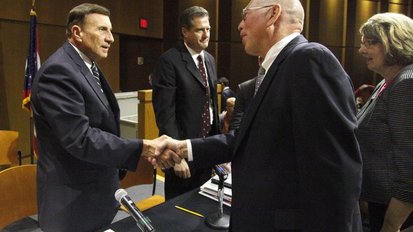 The House Oversight & Government Reform Subcommittee on Government Operations held a field hearing in 2013 at Sinclair Community College in Dayton on how the pensions of Delphi salaried retirees were treated. U.S. Rep. John Mica (R-FL) (left) and U.S. Rep. Mike Turner (right) greet Tom Rose and Mary Miller, both of Washington Township, after they participated on a panel representing the Delphi Salaried Retirees Association. LISA POWELL / STAFF