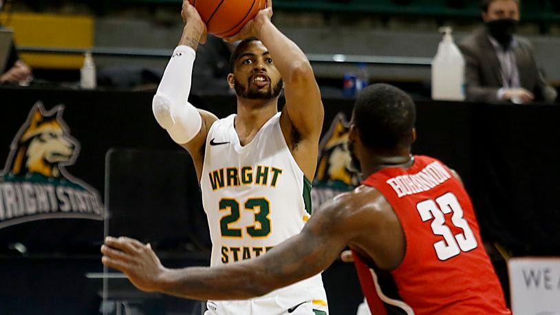Wright State forward James Manns connects for three over Youngstown State forward Naz Bohannon during a Horizon League game at the Nutter Center in Fairborn Jan. 9, 2021. Wright State won 93-55. Contributed photo by E.L. Hubbard