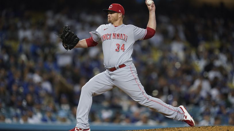 Cincinnati Reds relief pitcher Justin Wilson (34) throws during the seventh inning of a baseball game against the Los Angeles Dodgers in Los Angeles, Thursday, April 14, 2022. (AP Photo/Ashley Landis)
