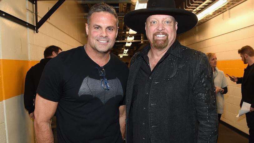 NASHVILLE, TN - FEBRUARY 08: Troy Gentry and Eddie Montgomery of Montgomery Gentry backstage during 1 Night. 1 Place. 1 Time: A Heroes & Friends Tribute to Randy Travis at Bridgestone Arena on February 8, 2017 in Nashville, Tennessee.  (Photo by Rick Diamond/Getty Images for Outback Concerts)