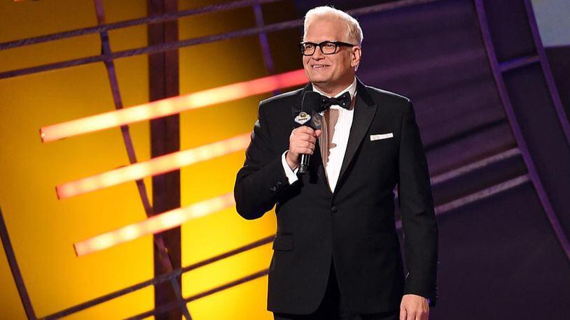 Television game show host Drew Carey speaks during the 2015 NASCAR Sprint Cup Series Awards show at Wynn Las Vegas on December 4, 2015 in Las Vegas, Nevada.