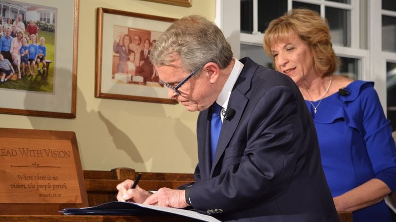 New Ohio Governor signs six executive orders immediately after taking office Monday at his home in Cedarville. Photo by Jim Otte, Newscenter 7