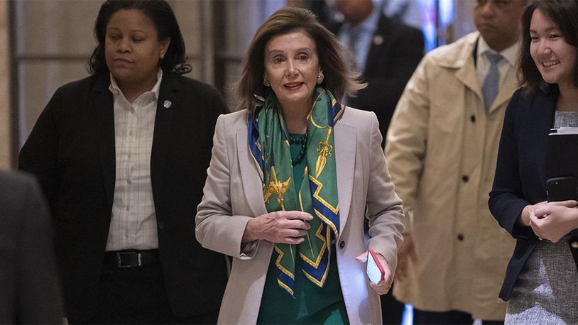 Speaker of the House Nancy Pelosi, D-Calif., arrives to meet with the Democratic Caucus at the Capitol in Washington, Tuesday, Jan. 14, 2020.