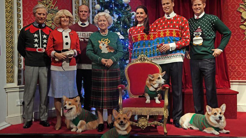 Corgi dogs join wax figures of members of the Royal family in Madame Tussauds, London, wear their Christmas jumpers to raise awareness of Save the Children. (Photo by Victoria Jones/PA Images via Getty Images)
