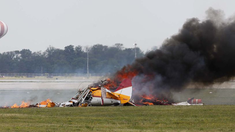 Wing walker Jane Wicker and biplane pilot Charlie Schwenker perished in this crash at the Vectren Dayton Air Show at approximately 12:45 p.m. on Saturday, June 22. TY GREENLEES / STAFF