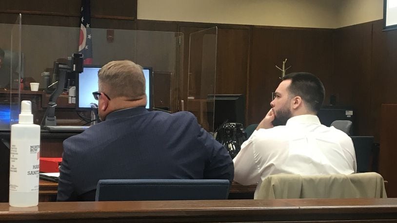 Dylan Dugan, 26, of Trotwood, right, appears with his attorney in Montgomery County Common Pleas Court Monday, July 26, 2021, for the first day of his murder trial in the September 2019 death of Mitchel Miller at a Kettering apartment. PARKER PERRY / STAFF