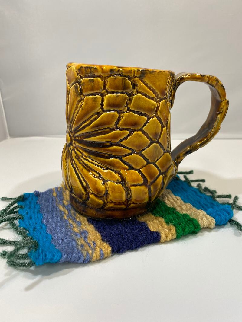 Ceramic mugs and mug rugs are among the items for sale at We Care Arts. CONTRIBUTED
