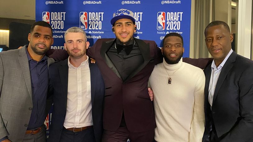 Obi Toppin, center, poses with (left to right) Dayton assistant coach Ricardo Greer, left, Dayton director of player development Brett Comer, former teammate Jalen Crutcher and Dayton head coach Anthony Grant on Wednesday, Nov. 18, 2020, in New York City, Photo courtesy of Ricardo Greer