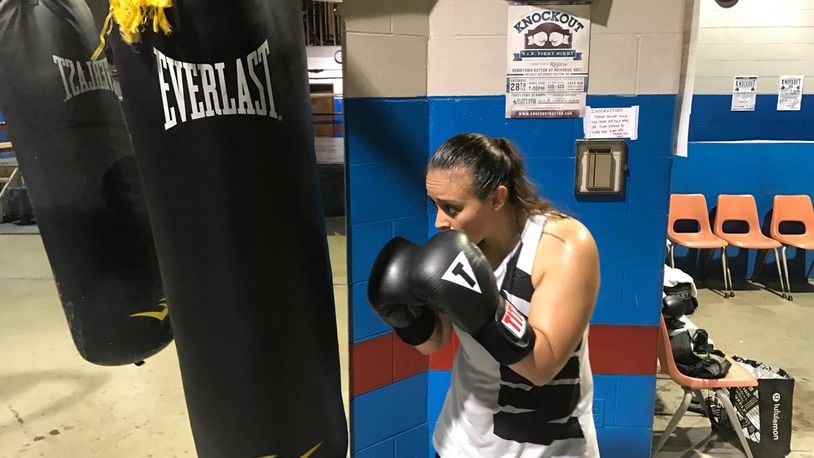 U.S. Air Force Airman 1st Class Jasmine Aldana, a former college soccer standout stationed at WPAFB, works out in Drake’s Downton Gym one night this week. She s fighting in one of the featured bouts Saturday night at the big Ale Beast charity boxing show outside Drake’s gym on E. Fifth Street next to the Oregon District. Tom Archdeacon/CONTRIBUTED