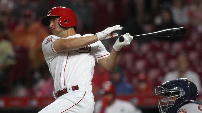 The Reds’ Nick Senzel drives in two runs with a single in the fifth against the Astros on Monday, June 17, 2019, at Great American Ball Park in Cincinnati. David Jablonski/Staff