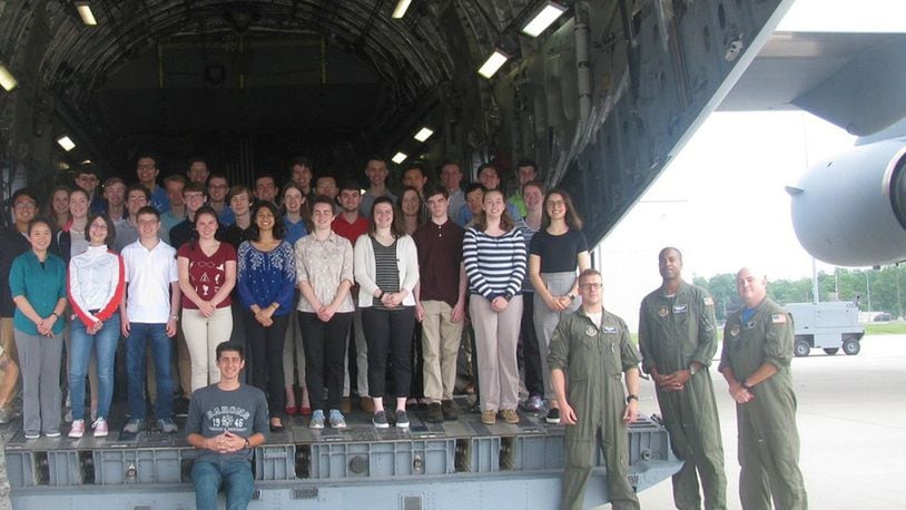 Wright Scholars pose on the tail of a C-17 at Wright-Patterson Air Force Base. The Wright Scholar Program at Wright-Patterson provides opportunities for high schoolers to explore and learn more about engineering, pre-medical sciences and other science, technology, engineering and math disciplines. (Courtesy photo)