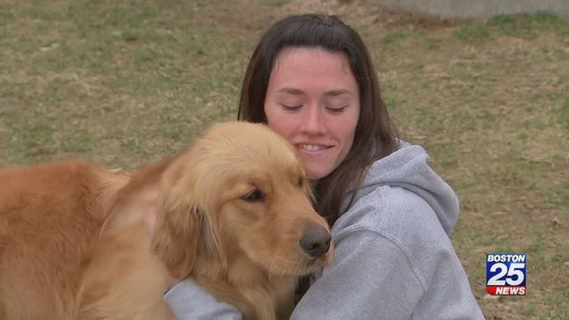 Alison Spirka, adoption coordinator for the Yankee Golden Retriever Rescue, enjoys time with a golden retriever.
