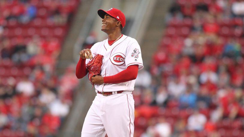 Reds reliever Raisel Iglesias smiles after walking a Phillies batter on Monday, April 3, 2017, at Great American Ball Park in Cincinnati. David Jablonski/Staff