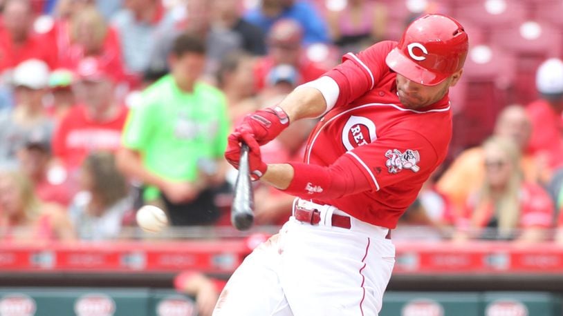 The Reds' Joey Votto swings during a game against the Pirates on Sunday, July 22, 2018, at Great American Ball Park in Cincinnati.