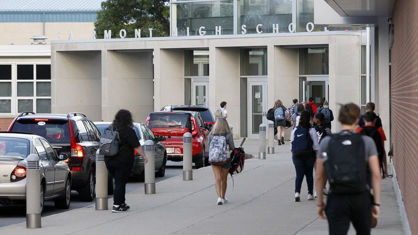 Students enter the main front door of Kettering Fairmont High School early on a fall morning. STAFF FILE PHOTO / TY GREENLEES