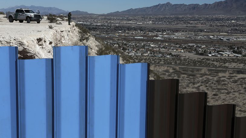An agent of the border patrol, observes near the Mexico-US border fence, on the Mexican side, separating the towns of Anapra, Mexico and Sunland Park, New Mexico, Wednesday, Jan. 25, 2017. U.S. President Donald Trump says his administration will be working in partnership in Mexico to improve safety and economic opportunity for both countries and will have "close coordination" with Mexico to address drug smuggling. It will set in motion the construction of his proposed border wall, a key promise from his 2016 campaign. (AP Photo/Christian Torres)