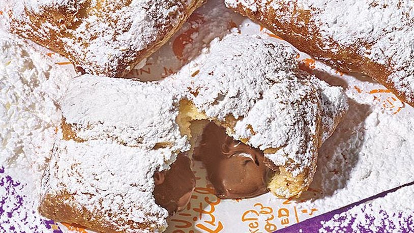 Popeyes chicken restaurants in southwest Ohio are now offering chocolate-filled beignets after the New Orleans-style dessert performed very well during its test-market phase. CONTRIBUTED