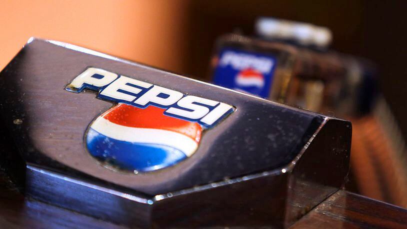 A Pepsi logo sits on a PepsiCo Inc. soft drinks pump on the bar inside The Yew Tree pub, operated by Chef and Brewer, a unit of Spirit Pub Co., in Great Horkesley, U.K., on Wednesday, Oct. 15, 2014. Spirit, the owner of more than 1,200 U.K. outlets including Chef & Brewer and Wacky Warehouse, said it rejected a 661 million-pound ($1.1 billion) all-share takeover approach from competitor Greene King Plc. (Chris Ratcliffe/Bloomberg via Getty Images)