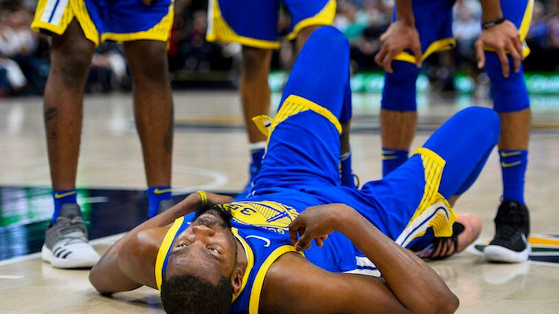 Golden State Warriors forward Kevin Durant (35) lies on the court during the first half of an NBA basketball game against the Utah Jazz on Tuesday, April 10, 2018, in Salt Lake City. (AP Photo/Alex Goodlett)