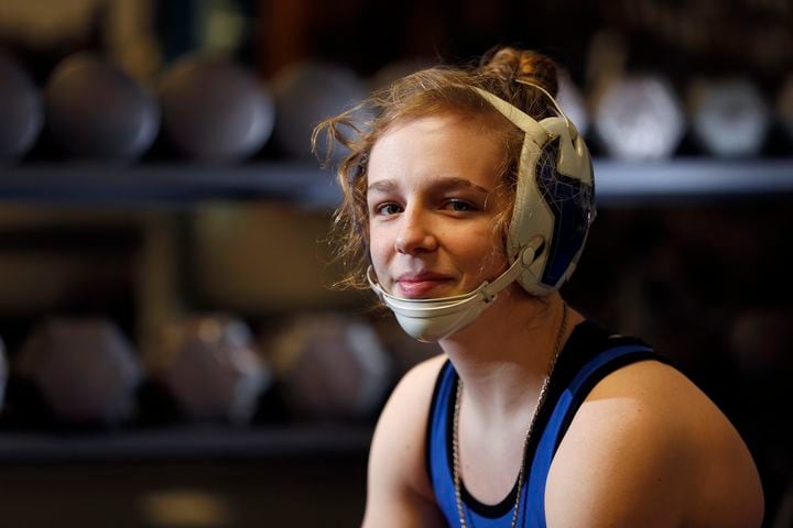 Young woman wrestles on high school team