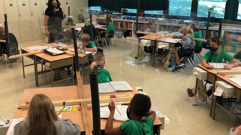 Second-graders in Carol Keating's classroom at St. Brigid's Catholic School in Xenia learn about synonyms Friday, Sept. 25, 2020.
