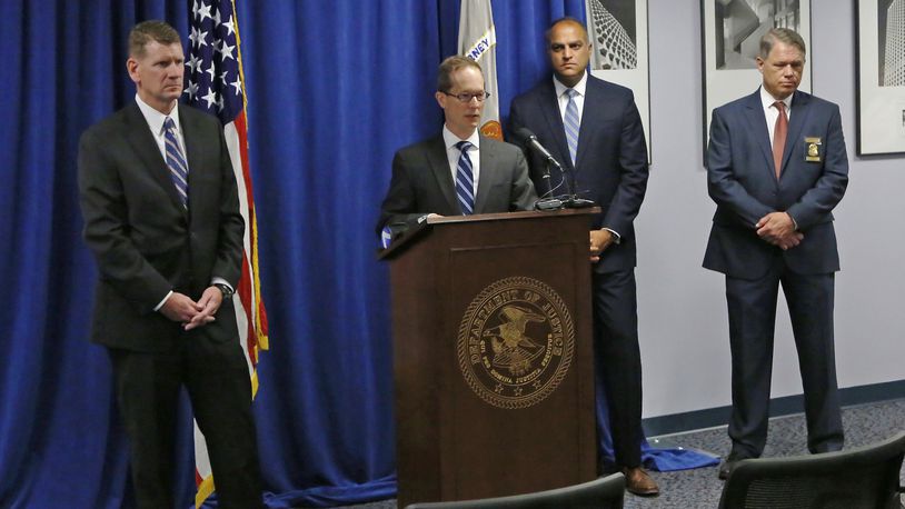 U.S. Attorney Benjamin Glassman, photographed at the podium, talks in August about the arrest of Ethan Kollie, a friend of Oregon District mass shooter Conner Betts. With Glassman from the left are Todd Wickerham, special agent in charge, FBI; Vipal Patel, first assistant U.S. attorney; and Dayton Police Chief Richard Biehl. TY GREENLEES / STAFF