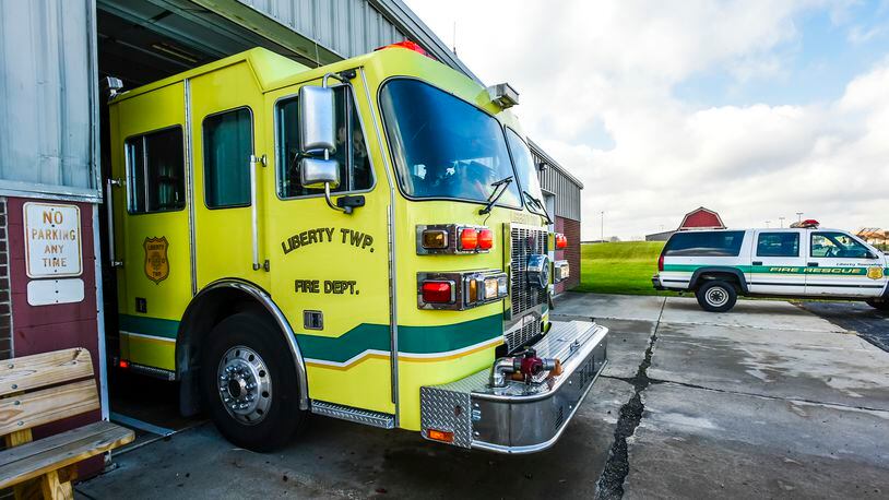 A crew with Liberty Township Fire Department responds to a call from their Yankee Road Station, the oldest of their three buildings, Wednesday, Nov. 30 in Liberty Township. NICK GRAHAM/STAFF