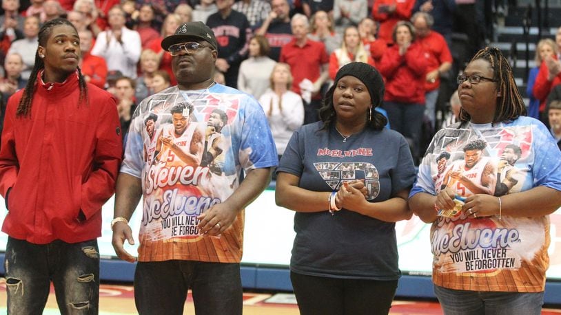 Dayton honors the family of Steve McElvene at halftime of a game against Richmond on Sunday, Jan. 6, 2019, at UD Arena. David Jablonski/Staff