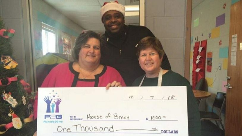 Jeff Jackson, middle, co-founded Planned2Give, a non-profit that helps other non-profits raise money. Lisa Grigsby, left, nominated Jackson as a Community Gem. Melodie Bennett of House of Bread recently accepted a donation from the organization.