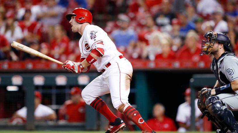 Patrick Kivlehan Reds looks up as he hits a grand slam home run in the eighth inning of Monday night's game against the Padres at Great American Ball Park. The Reds defeated the Padres 11-3.
