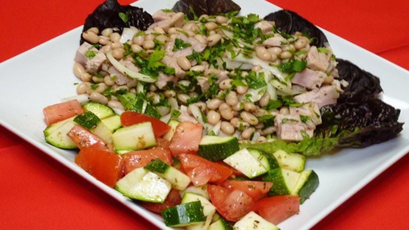 This Tuscan Bean and Tuna Salad uses fresh tuna. Red onion lends texture and flavor to the salad. (Linda Gassenheimer/TNS)