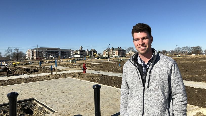 Matt Obringer, project manager for the Union Village planned community in Warren County, stands where the first neighborhood is expected to take shape over the next year. The Otterbein retirement campus stands on the other side of Ohio 741. STAFF/LAWRENCE BUDD