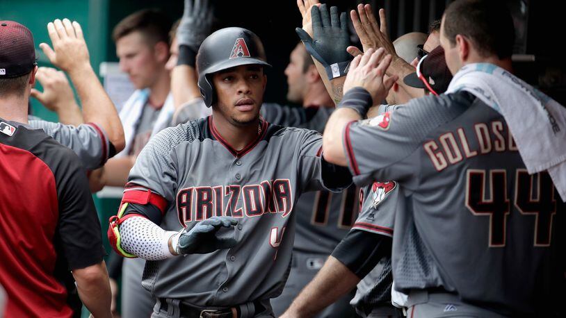 CINCINNATI, OH - JULY 20: Ketel Marte #4 of the Arizona Diamondbacks celebrates with teammates after hitting a two run home run in the ninth inning against the Cincinnati Reds at Great American Ball Park on July 20, 2017 in Cincinnati, Ohio. (Photo by Andy Lyons/Getty Images)