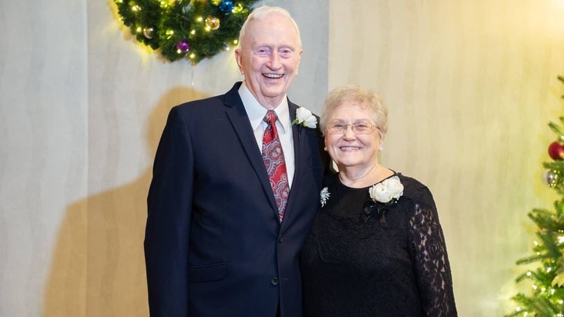 Ron, 90, and Faye, 88, Duncan posing for a photo at a Christmas celebration.
