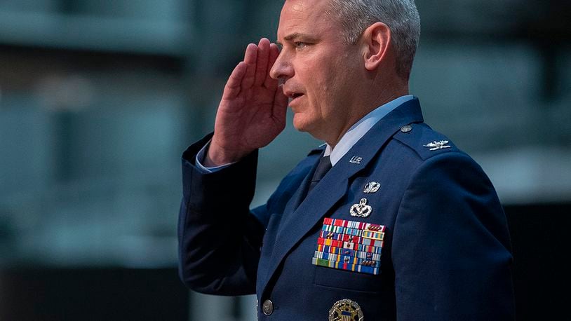 Col. Christopher Meeker returns his first salute as 88th Air Base Wing and installation commander during a change of command ceremony July 7 inside the National Museum of the U.S. Air Force. U.S. AIR FORCE PHOTO/R.J. ORIEZ