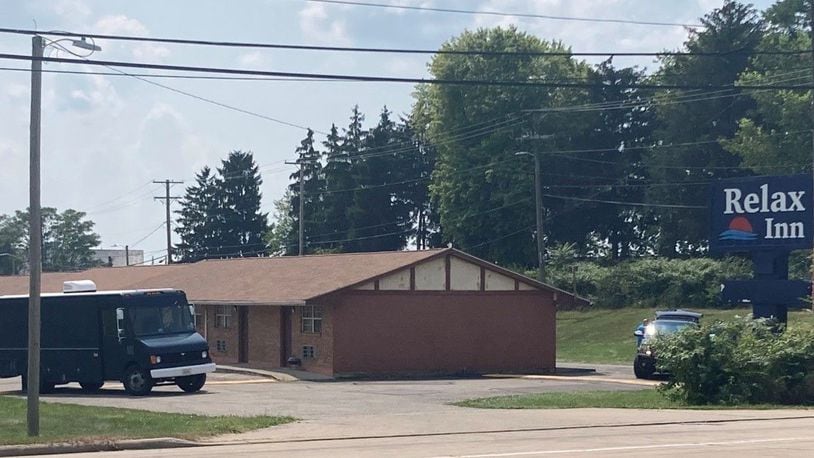 A Dayton man surrendered after an hourslong standoff Sunday, Aug. 8, 2021, at the Relax Inn on South Dixie Drive in Moraine after telling police he had "guns and bombs," according to a report. No weapons or devices were found and no one was hurt. KAITLIN SCHROEDER/STAFF