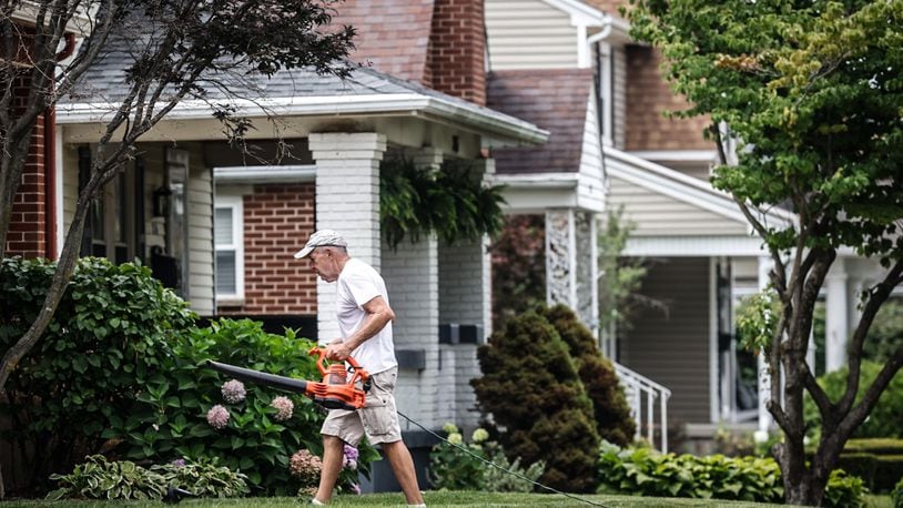 Bob Pack helps a friend with his lawn on Cushing Ave. in Kettering Thursday July 27, 2023. Most of the growth in residential value is in the southern part of county, including Kettering at $987 million increase in property values. JIM NOELKER/STAFF