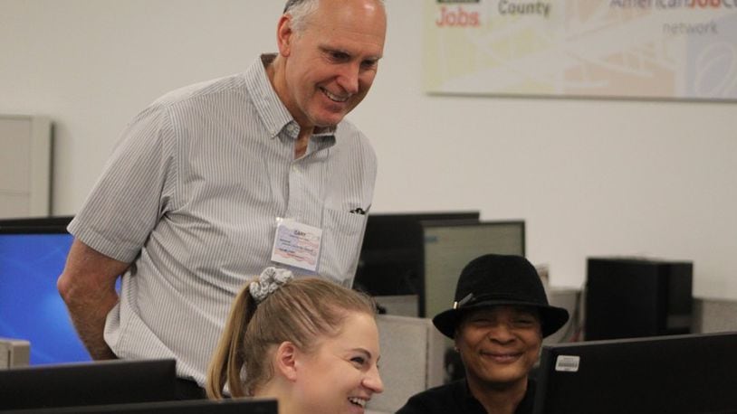 University of Dayton student Claire Vogel helped prepare and submit 58-year-old Teresa Rainey’s tax returns at the Job Center in this file photo. Volunteer Gary Dowdy also helped low- and moderate-income residents file their returns. CORNELIUS FROLIK / STAFF