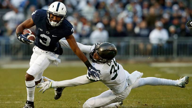 Penn State’s DeAndre Thompkins (3) gets past Michigan State’s Justin Layne (39) after a catch during the first half of an NCAA college football game in State College, Pa., Saturday Nov. 26, 2016. (AP Photo/Chris Knight)