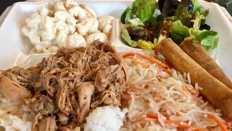 HaolePino is a food truck that serves Hawaiian and Filipino food in the Dayton-area. Here is the Ultimate Filipino Mixed Plate, which includes chicken adobo over rice, pancit and lumpia. ALLEGRA CZERWINSKI / STAFF