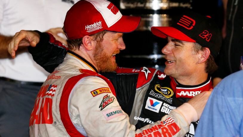 DAYTONA BEACH, FL - FEBRUARY 23: Dale Earnhardt Jr., driver of the #88 National Guard Chevrolet (left), celebrates with Jeff Gordon, driver of the #24 Drive To End Hunger Chevrolet, in victory lane after winning during the NASCAR Sprint Cup Series Daytona 500 at Daytona International Speedway on February 23, 2014 in Daytona Beach, Florida. (Photo by Tom Pennington/Getty Images)