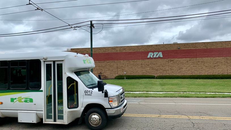 An RTA vehicle drives in front of the RTA maintenance facility at 601 Longworth St., where an underground storage tank leaked more than 6,000 gallons of diesel fuel in August/ Staff photo by Jordan Laird.