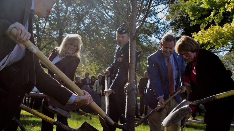 The planting of the 1,001 cherry tree in the Dayton area. From left, Montgomery Commissioners Dan Foley and Debbie Lieberman; Col. Bradley McDonald 88th Air Base Wing and Installation Commander at Wright-Patterson Air Force Base; Brookville Mayor Dave Seagraves and Montgomery County Commissioner Judy Dodge. CORNELIUS FROLIK / STAFF