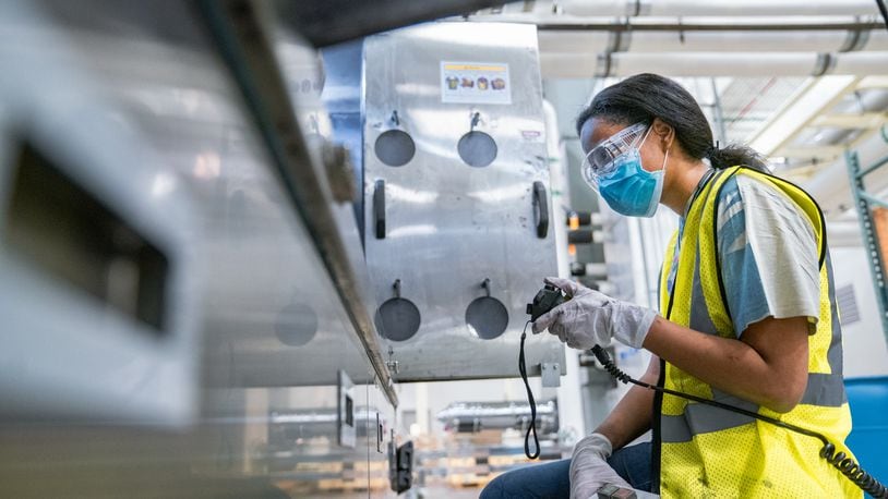 Lauren Poellnitz, a process engineer at Silfex, works inside the company's facility in Springfield that is on Titus Road. That location now boast a workforce of over 500 people, surpassing original growth expectations. Mark Schmitter, Contributed.